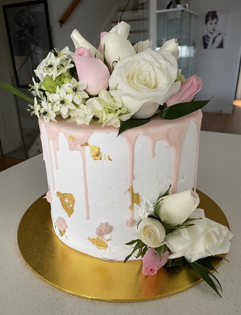 Pale Pink Drip Buttercream Cake With Fresh Flowers - Sweet infusion Cakes