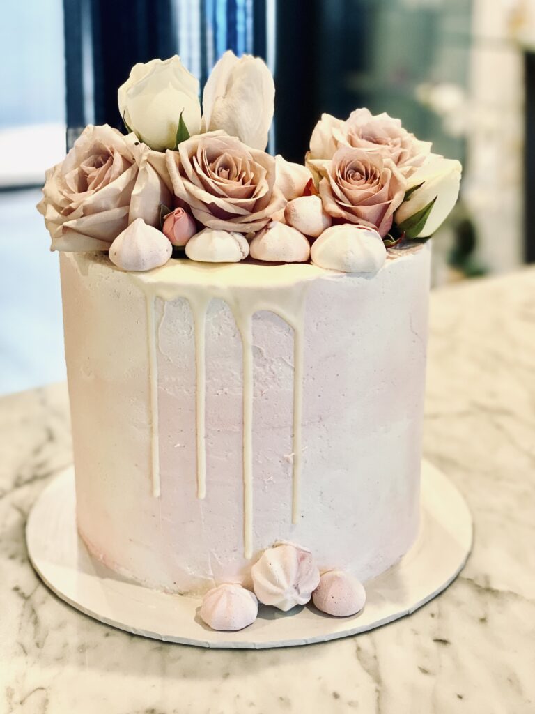 Pale Pink White Drip Cake With Fresh Flowers - Sweet infusion Cakes